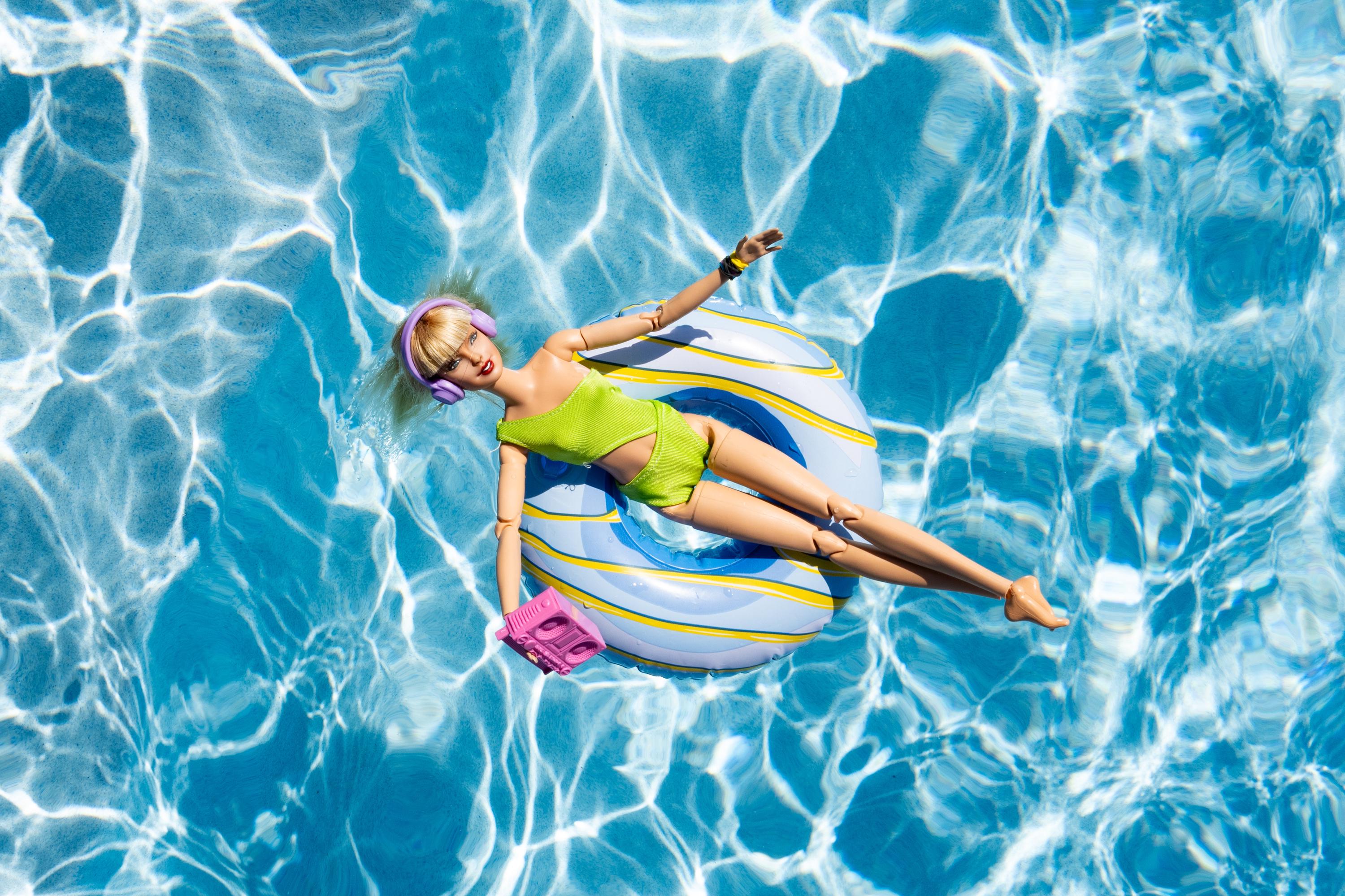 Fun Doll Pool Float Art Print – Vibrant Summer Photography