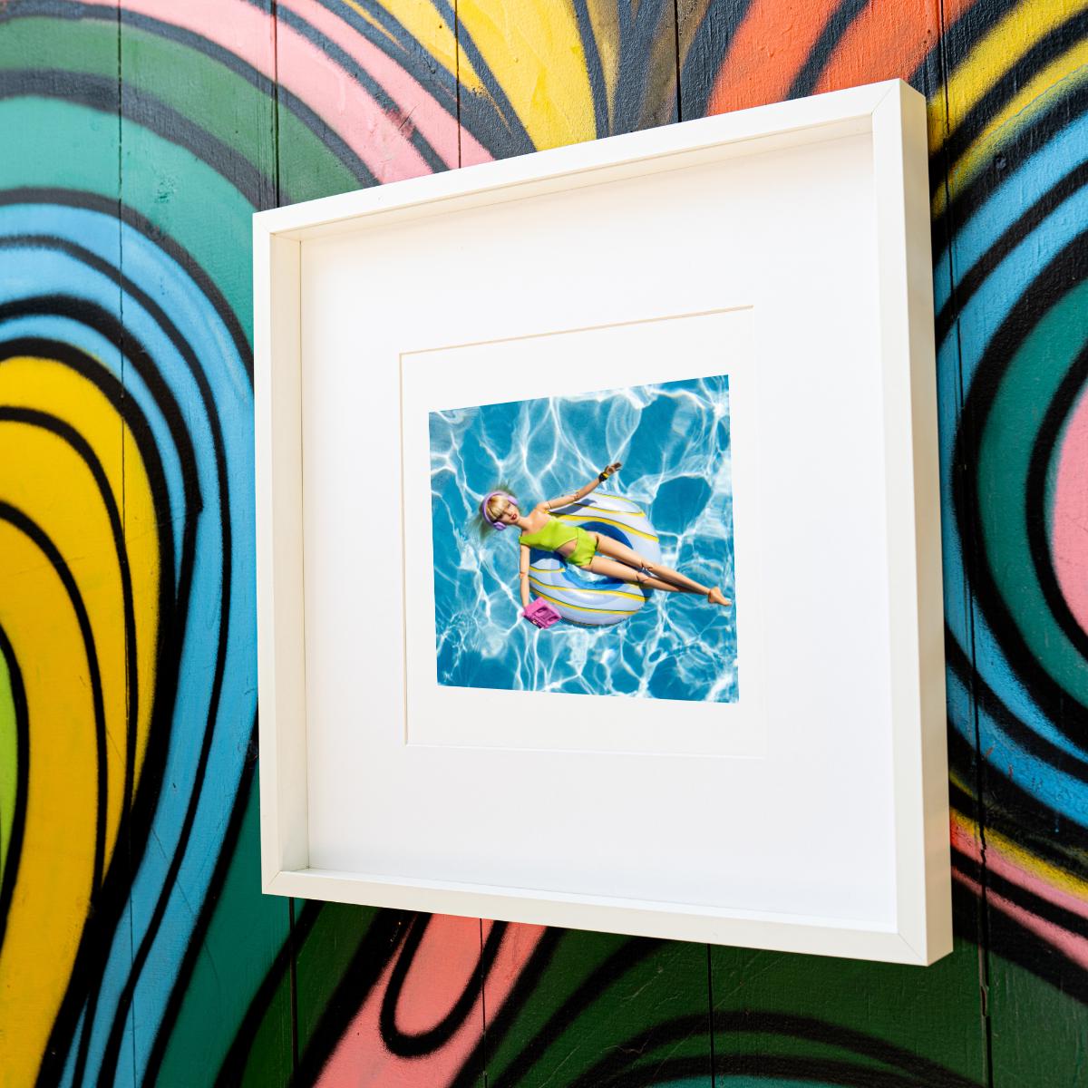 Fun Doll Pool Float Art Print – Vibrant Summer Photography