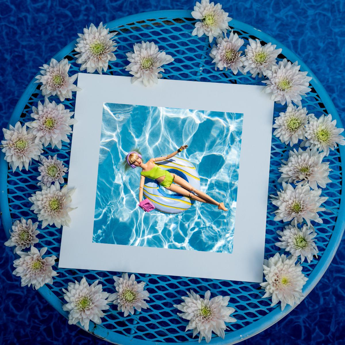 Fun Doll Pool Float Art Print – Vibrant Summer Photography